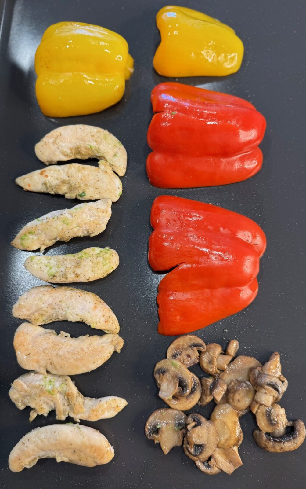 Ingredients laid out on griddle.