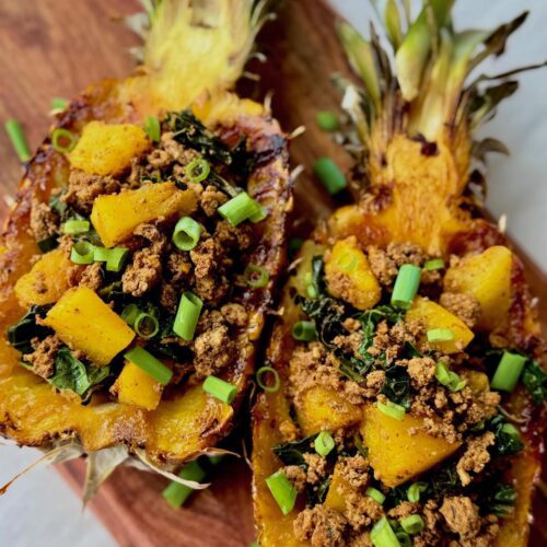 tropical turkey tacos featured in pineapple halves,