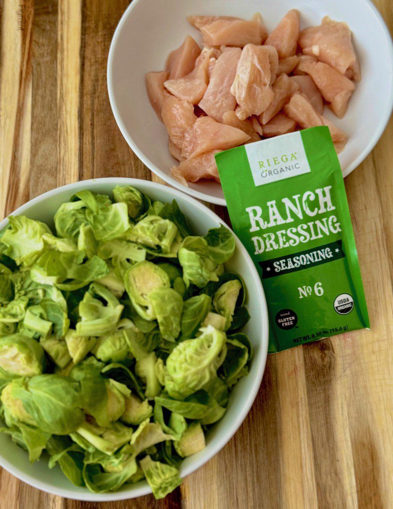 ranch seasoning packet, chicken in white bowl, cut brussel sprouts