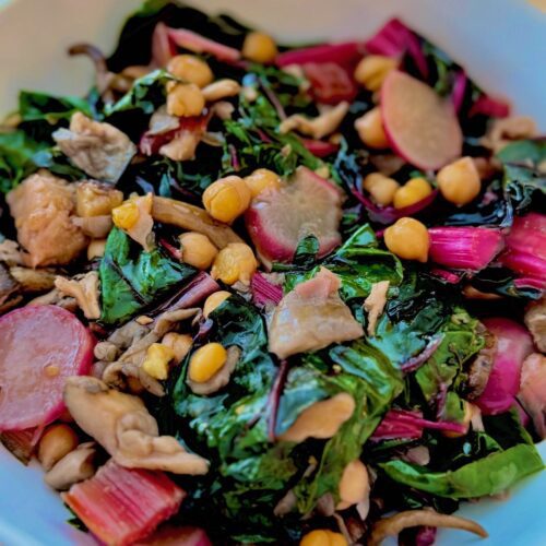swiss chard and chickpeas in white bowl