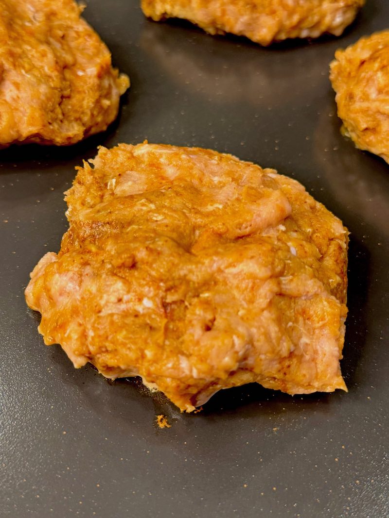 formed burger patty on griddle