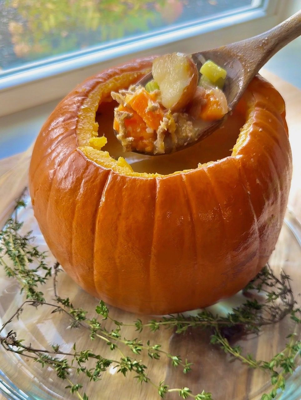 pumpkin turkey sage soup featured with wooden spoon